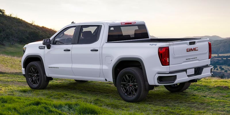 White GMC Sierra 1500 on Grass